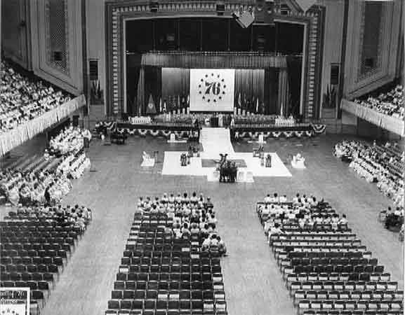 A black and white photo of a large auditorium.