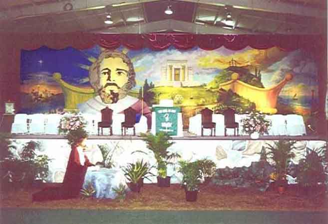 A stage with a painting of jesus on it.