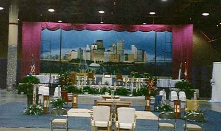A stage setting with a large mural on the wall.