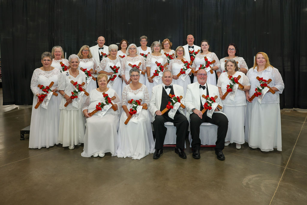 Grand Officers (1) Large, smiling group dressed in white.